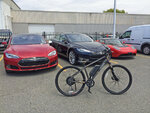 electric-bike-with-sports-cars.jpg