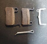 one side worn brake pads.JPG