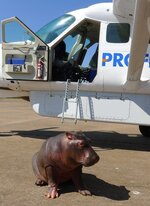 Doug with plane that brought him to us.jpg