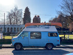 traveling-couple-with-canoo-sitting-on-roof-of-rv-van-vancouver-bc-canada.jpg